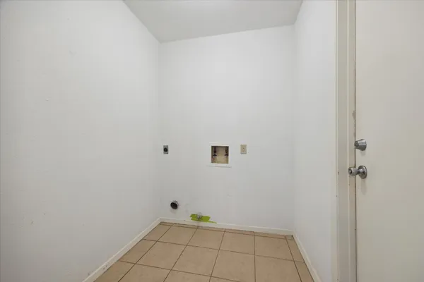 a view of an empty room with a fan