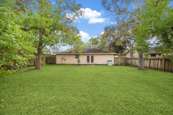 a view of backyard with green space