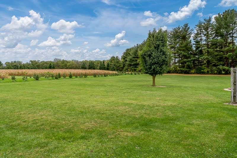 2369 South Lowden Road Oregon, IL 61061 - Photo 12 of 51 a view of grassy field with trees