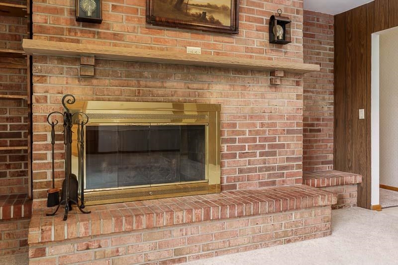 2369 South Lowden Road Oregon, IL 61061 - Photo 19 of 51 a view of a fireplace with wooden floor