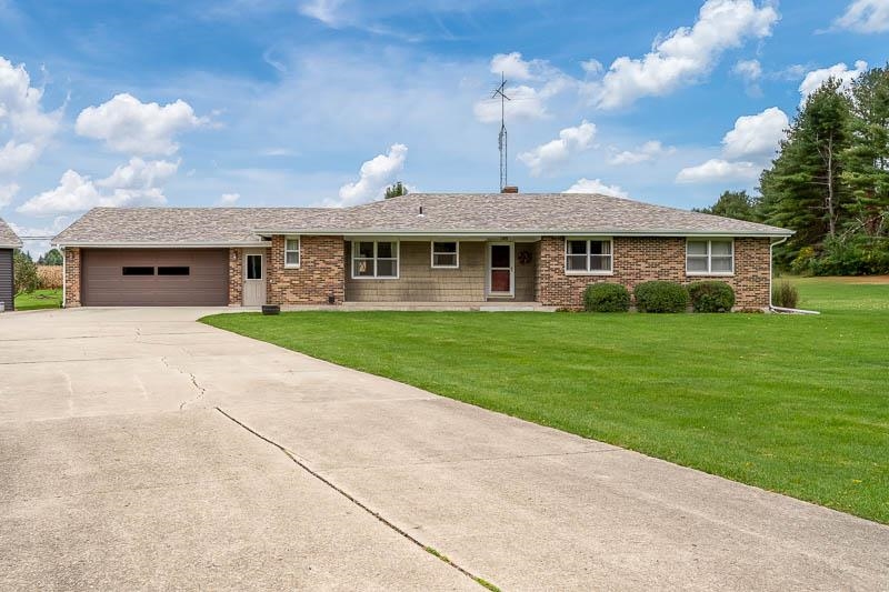 2369 South Lowden Road Oregon, IL 61061 - Photo 2 of 51 a front view of a house with a yard
