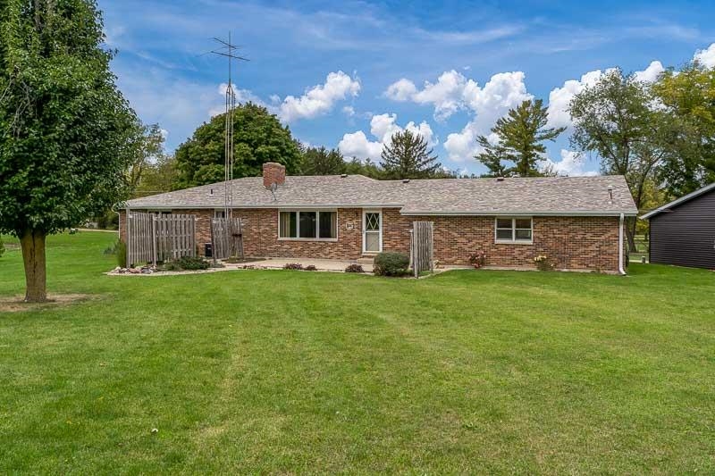 2369 South Lowden Road Oregon, IL 61061 - Photo 7 of 51 a front view of a house with a garden