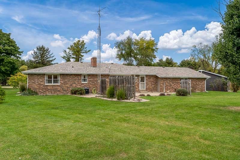 2369 South Lowden Road Oregon, IL 61061 - Photo 8 of 51 a front view of a house with a garden