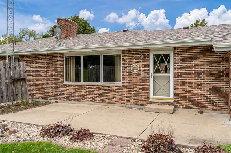 2369 South Lowden Road Oregon, IL 61061 - Photo 10 of 51 a view of a brick house with potted plants