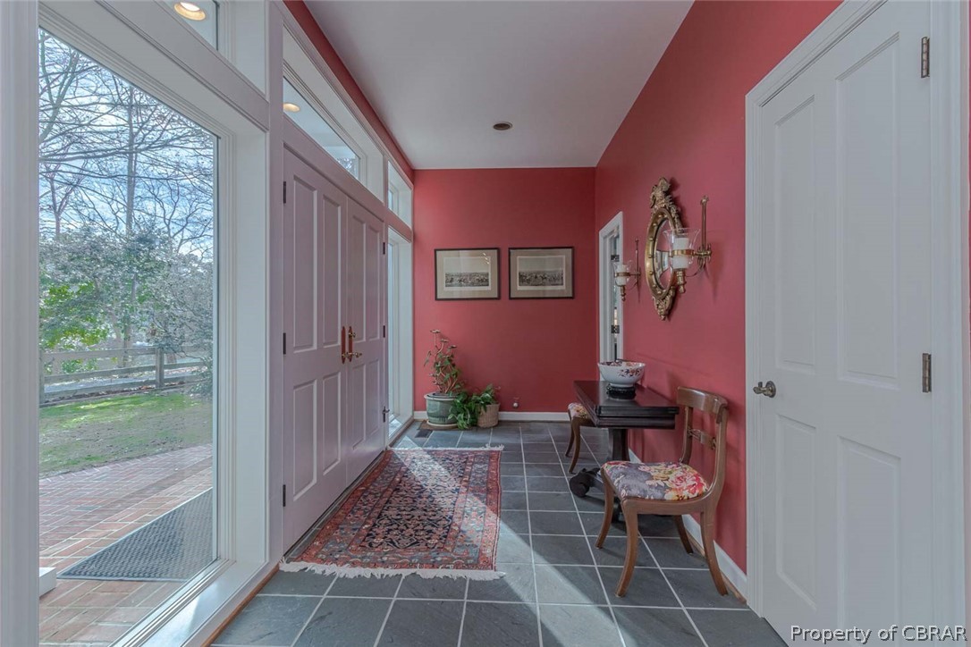 1028 Blueberry Point Road White Stone, VA 22578 - Photo 23 of 49 Welcome! Slate floors & a coat closet are located in the Foyer with Living area to the side & bedroom to the other.