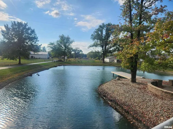 a view of a lake with a yard