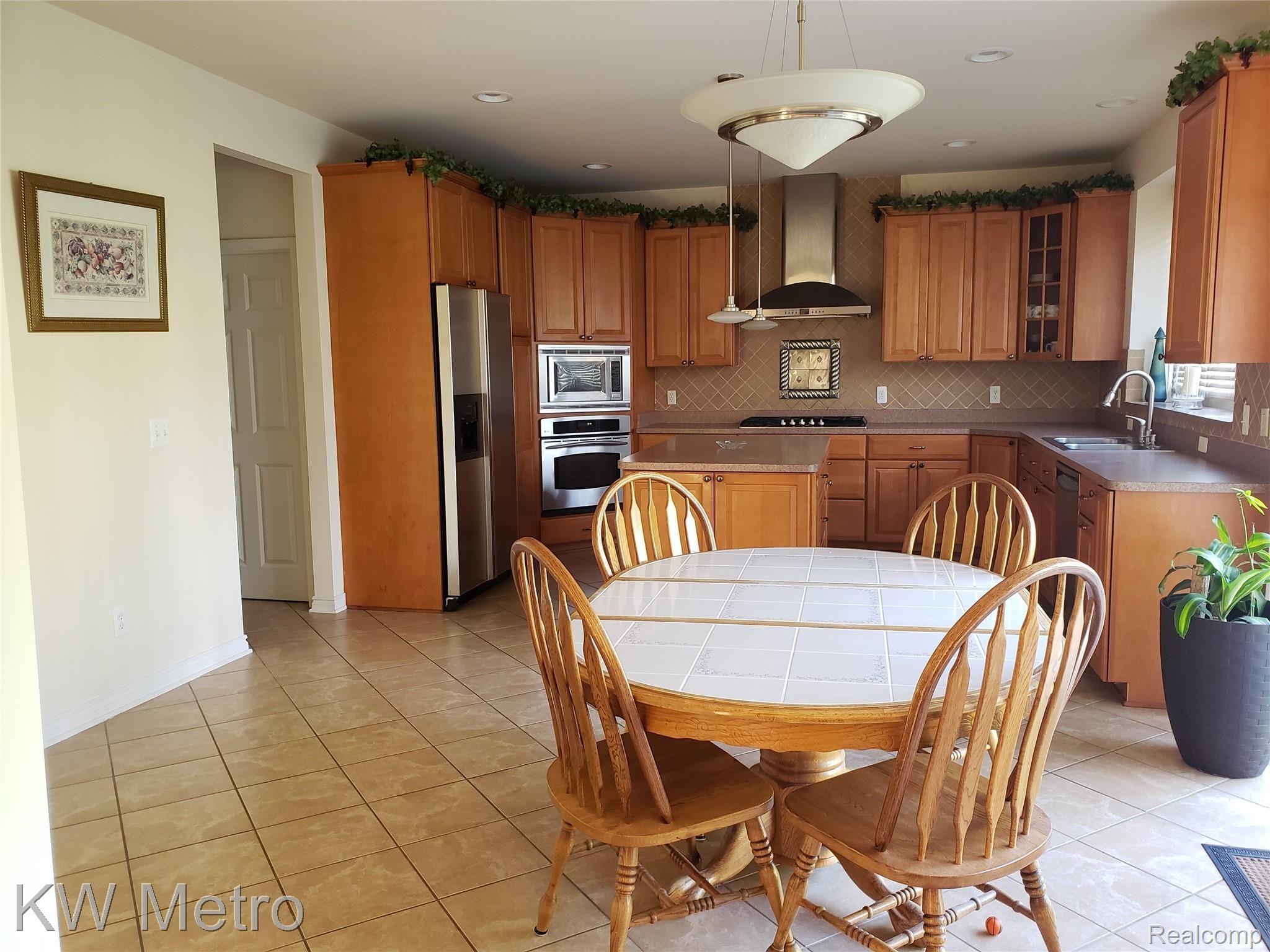 1227 Letica Drive Rochester, MI 48307 - Photo 23 of 58 Kitchen with Vented Hood
