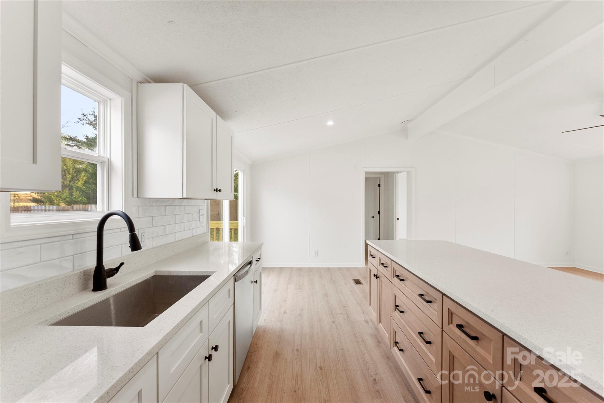 226 Muldoon Lane Clover, SC 29710 - Photo 12 of 31 a kitchen with sink a stove and cabinets