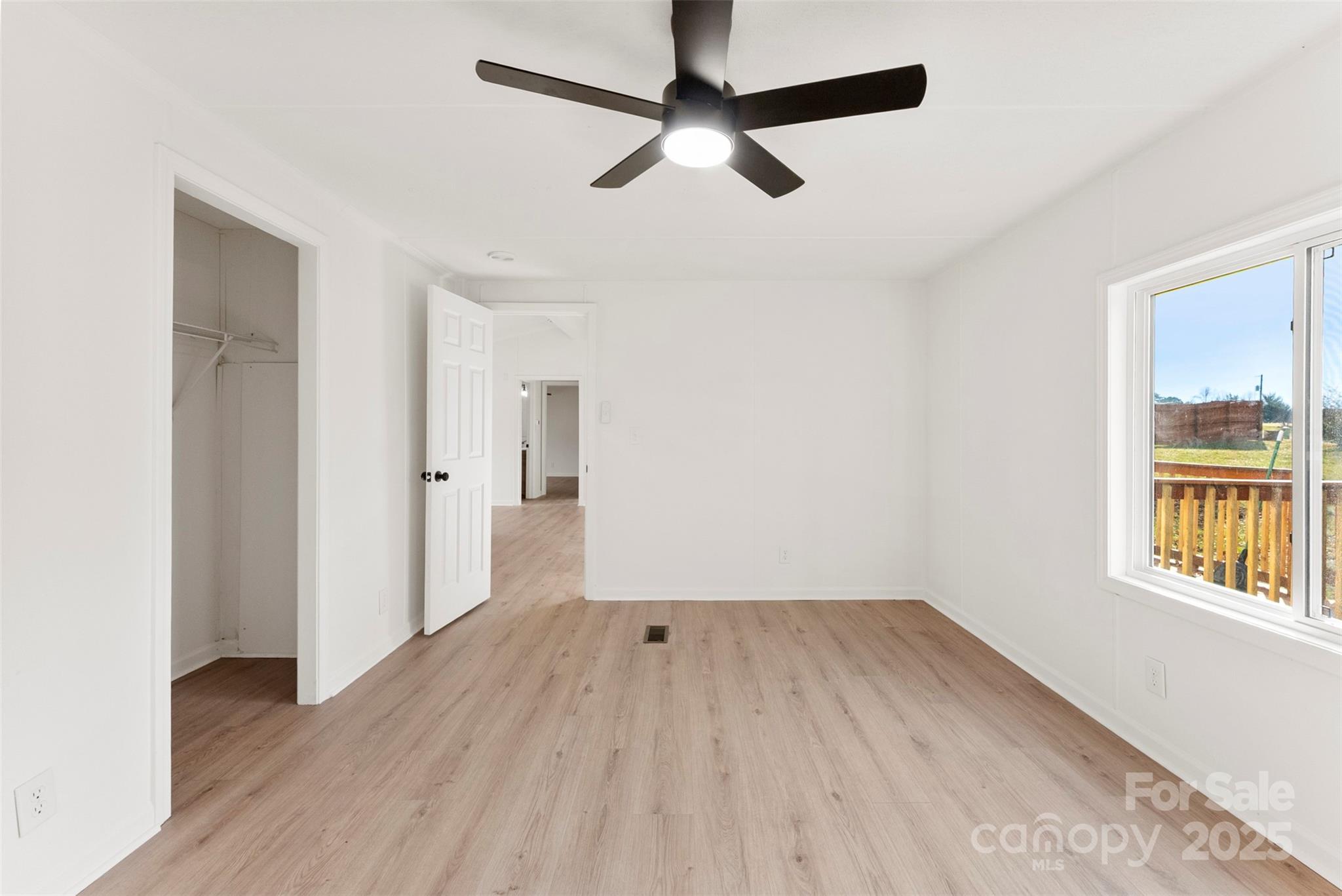 226 Muldoon Lane Clover, SC 29710 - Photo 15 of 31 wooden floor in an empty room with a window