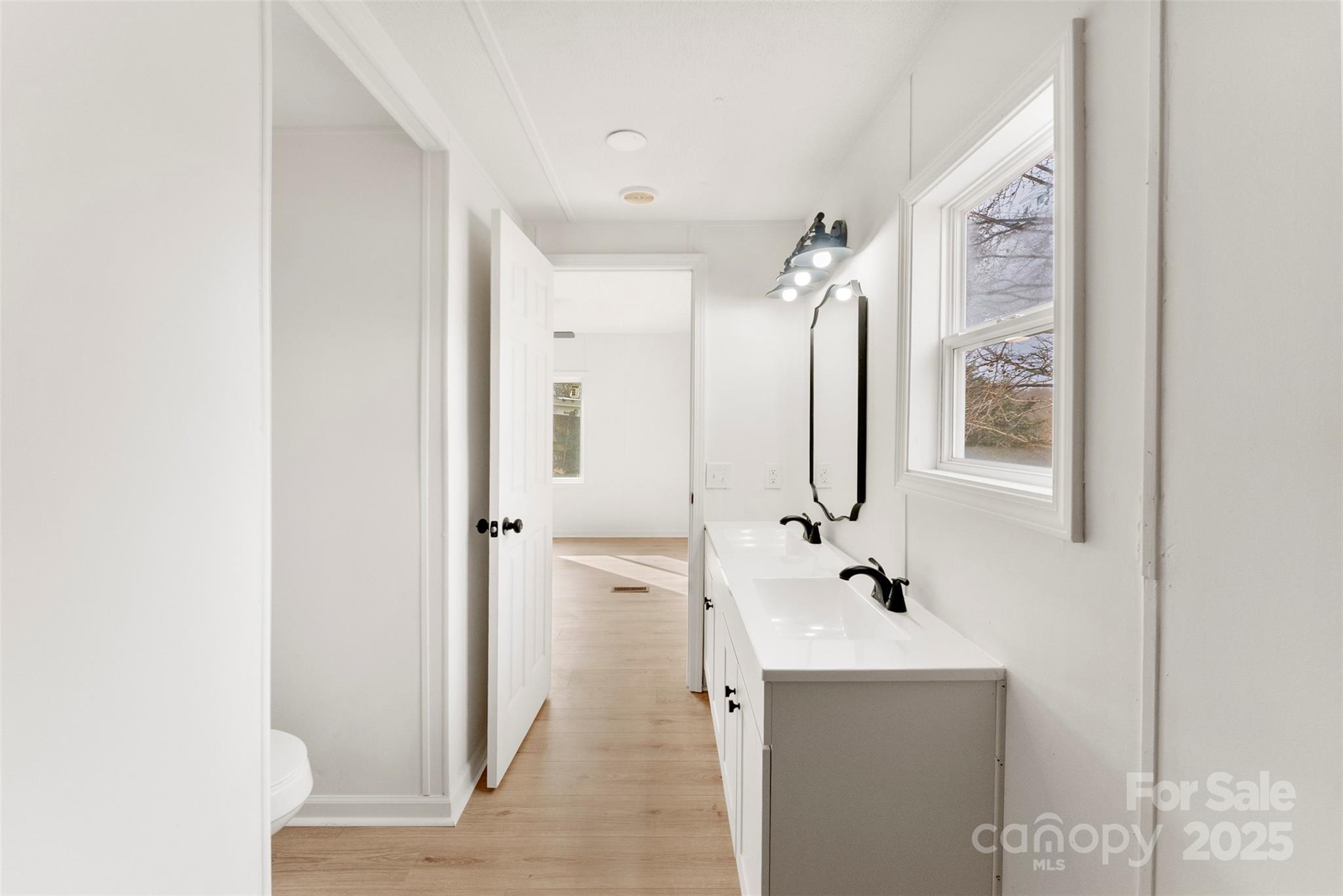 226 Muldoon Lane Clover, SC 29710 - Photo 17 of 31 a bathroom with a bathtub sink and mirror