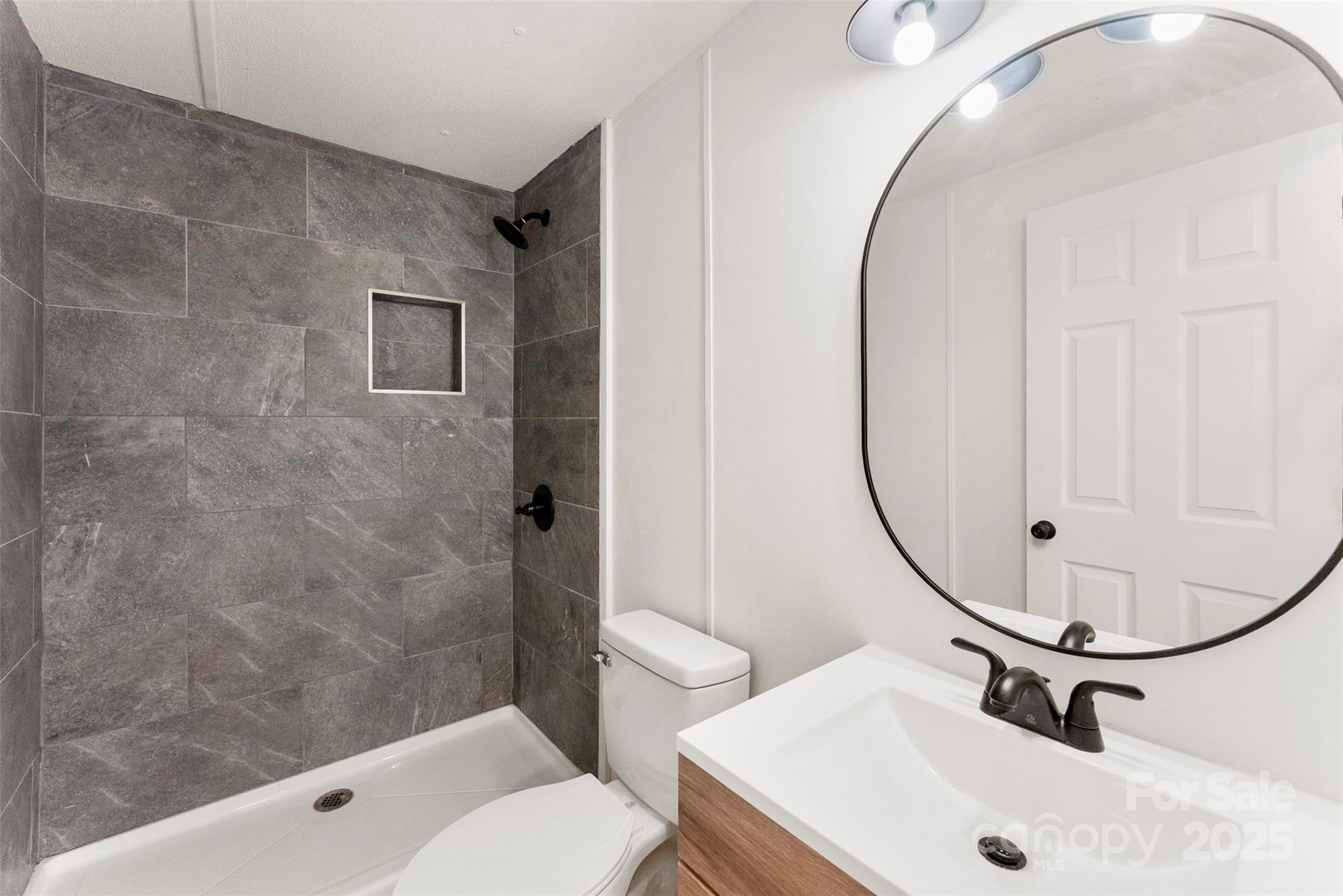 226 Muldoon Lane Clover, SC 29710 - Photo 19 of 31 a bathroom with a sink toilet and shower