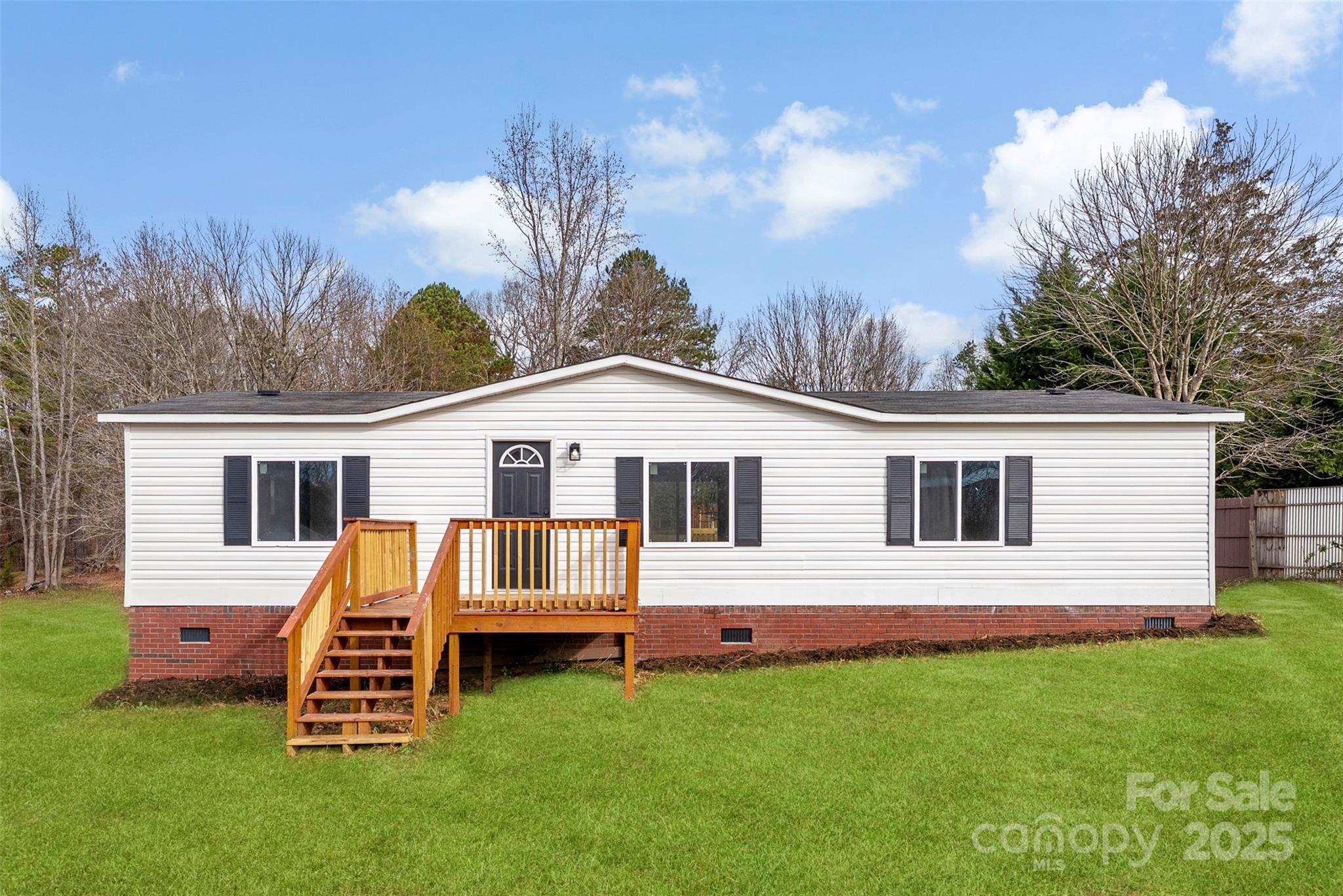 226 Muldoon Lane Clover, SC 29710 - Photo 2 of 31 a front view of a house with a garden