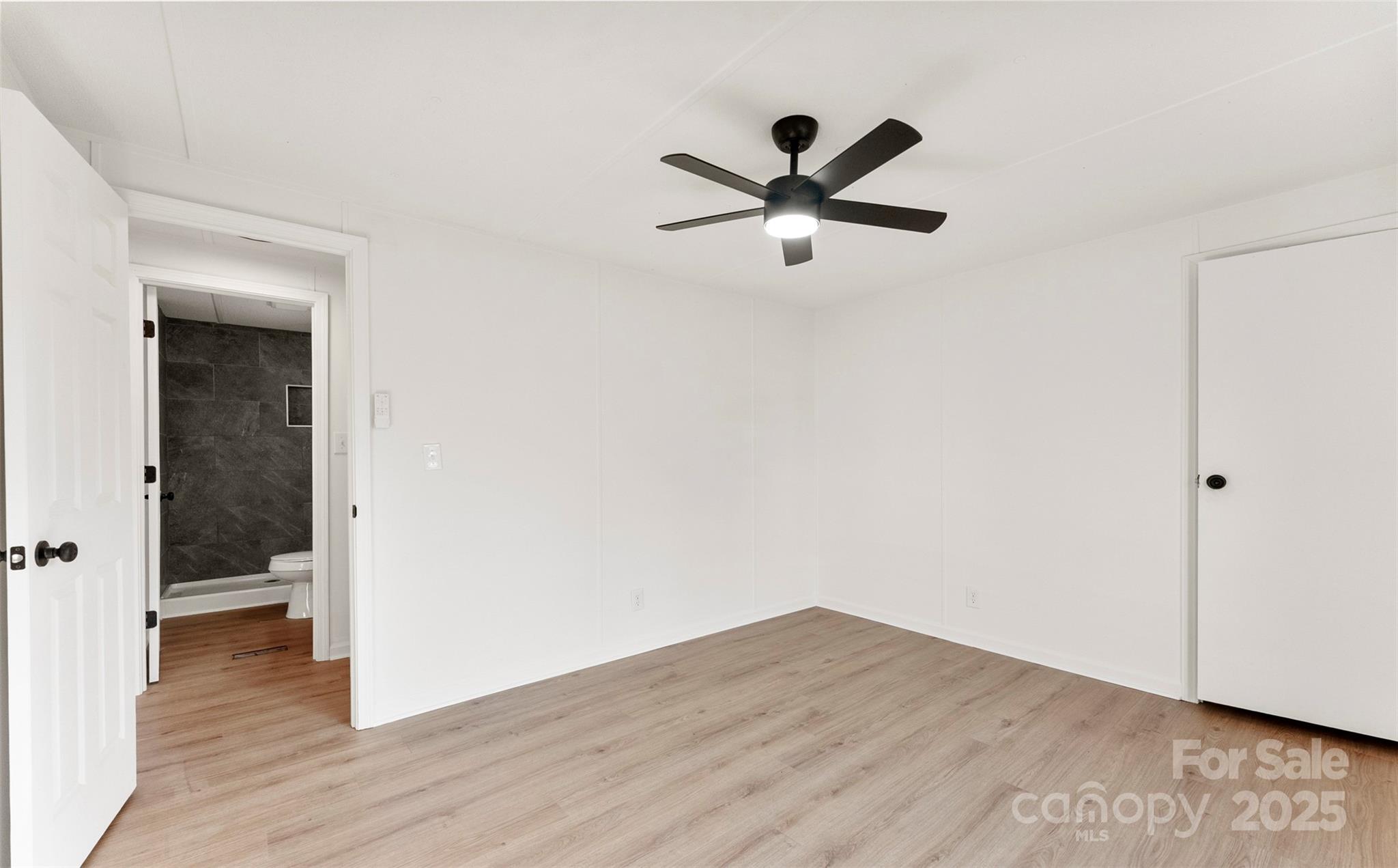 226 Muldoon Lane Clover, SC 29710 - Photo 21 of 31 a view of a hallway with wooden floor and closet