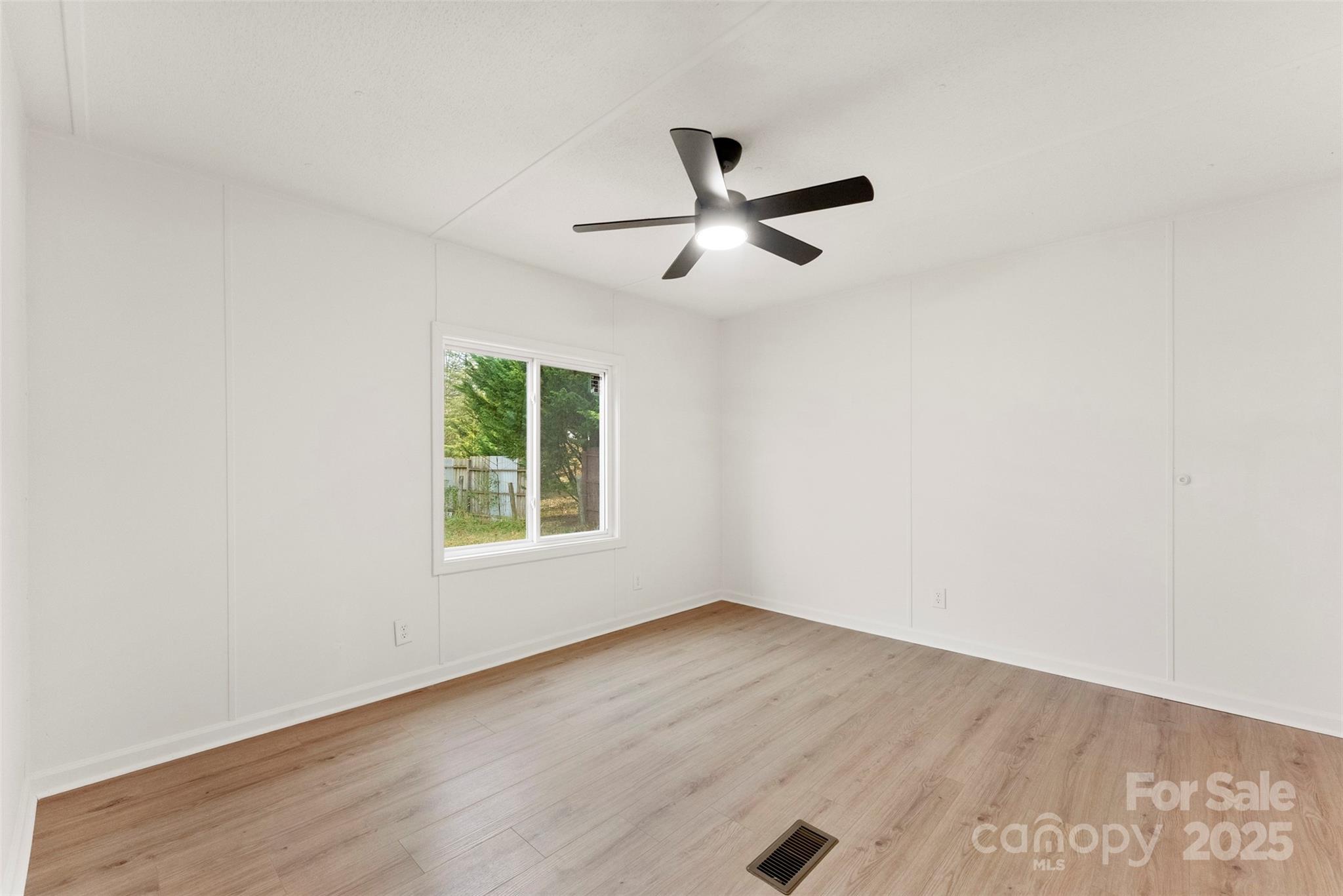 226 Muldoon Lane Clover, SC 29710 - Photo 22 of 31 a view of a room with wooden floor and windows