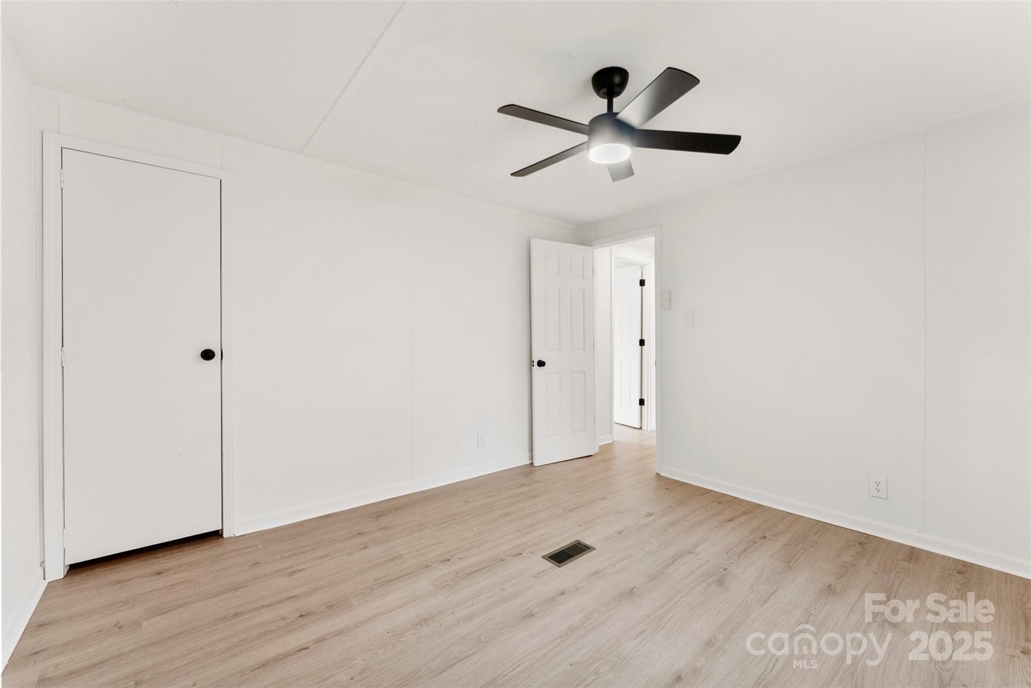 226 Muldoon Lane Clover, SC 29710 - Photo 23 of 31 a view of empty room with wooden floor