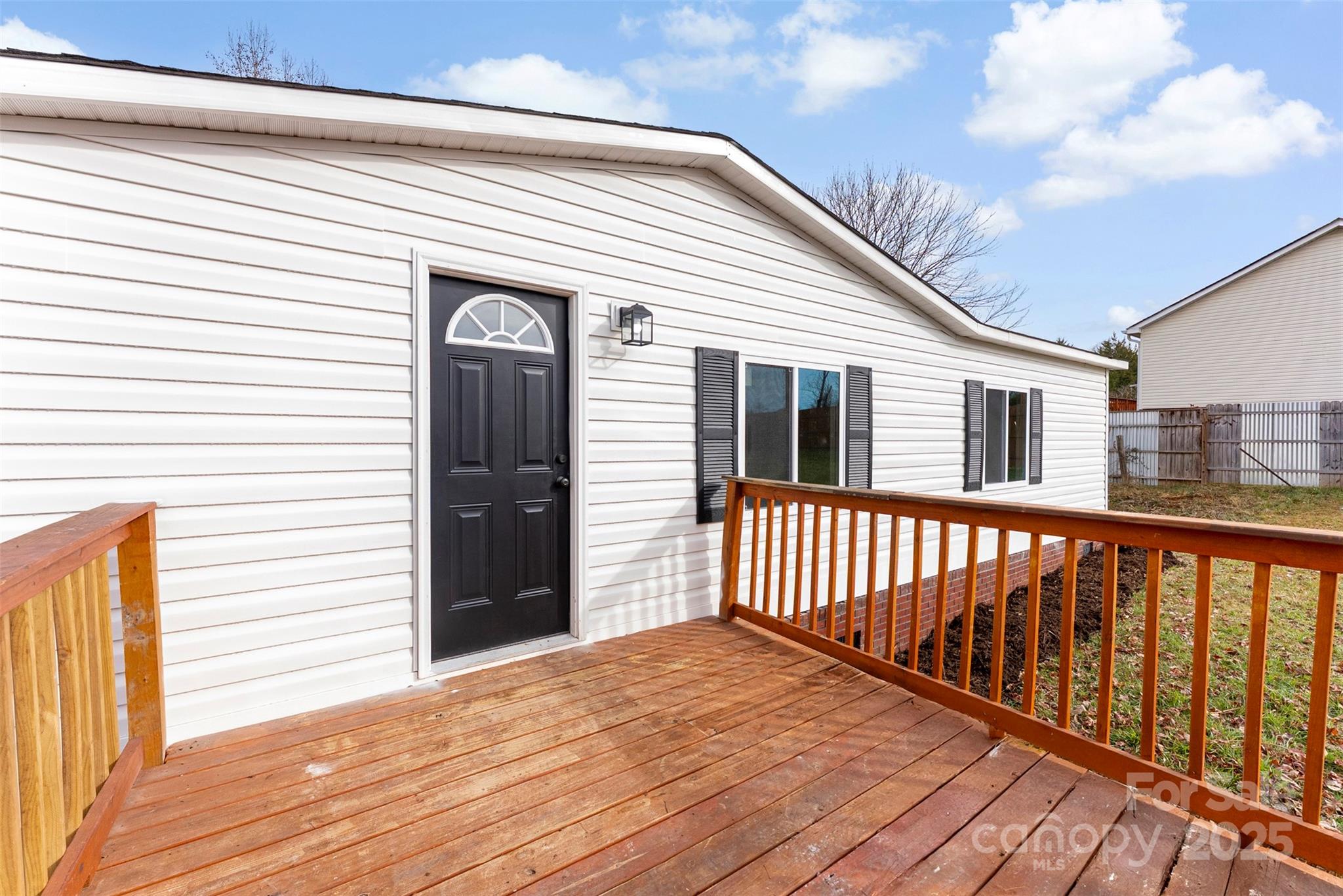 226 Muldoon Lane Clover, SC 29710 - Photo 3 of 31 a view of a house with wooden deck
