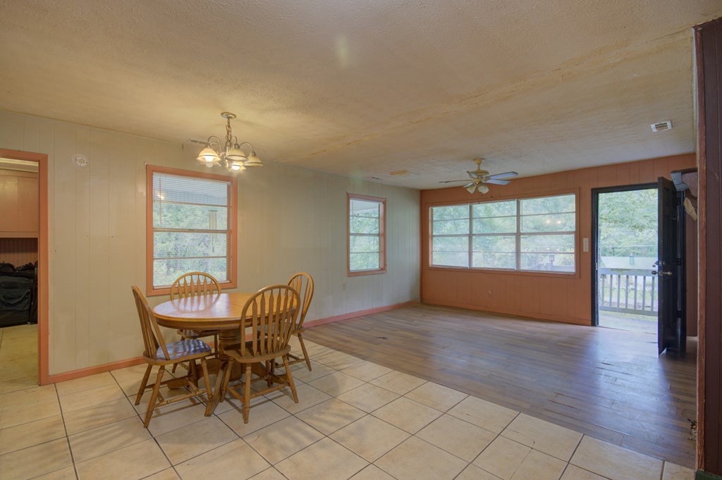92 No-Where Road Blairsville, GA 30512 - Photo 8 of 36 a view of a livingroom with furniture wooden floor and chandelier