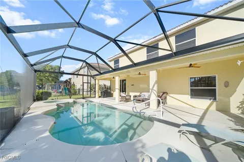 a view of swimming pool with a sitting space