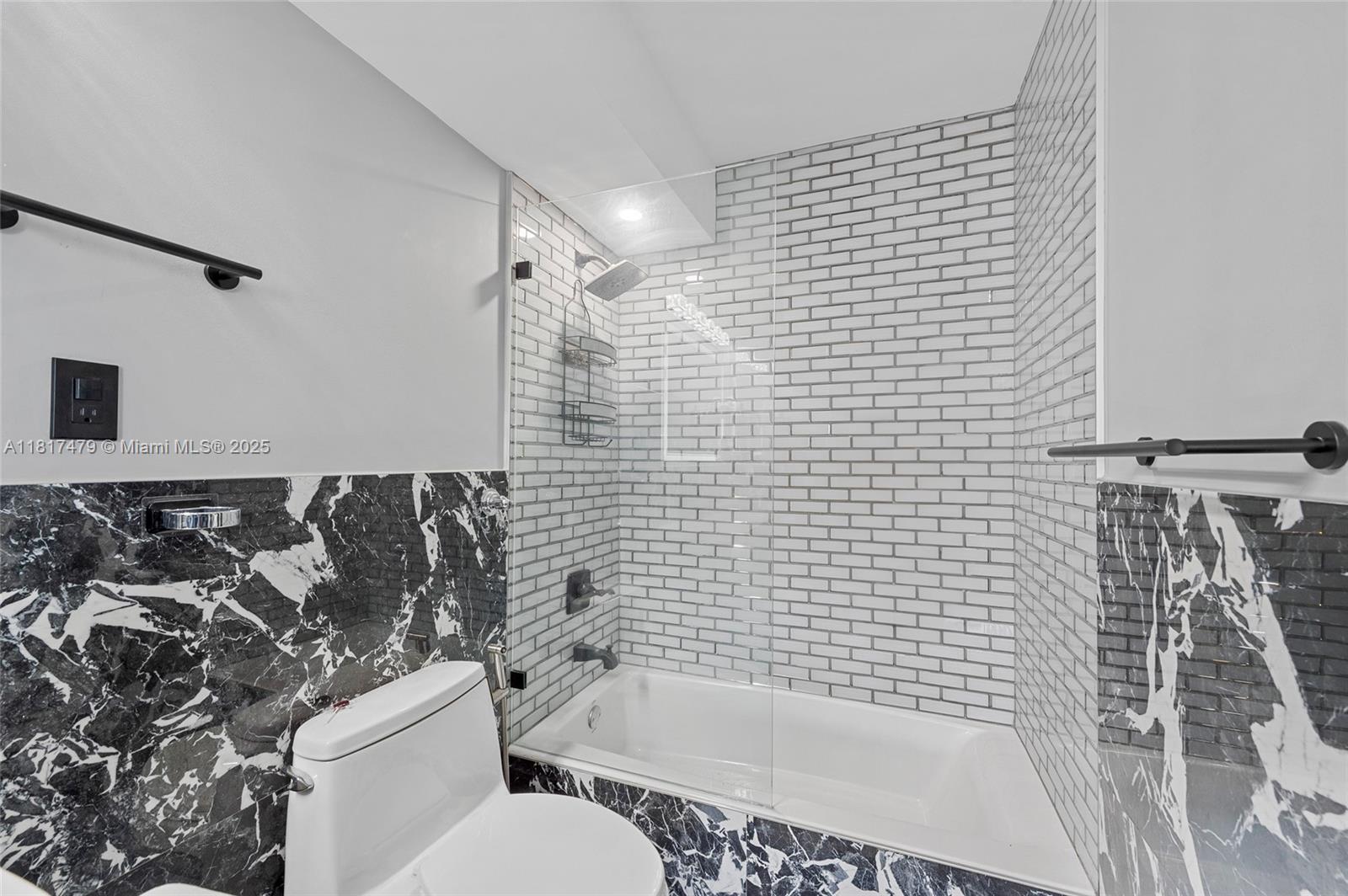 1345 Lincoln Road, Unit 1105 Miami Beach, FL 33139 - Photo 11 of 25 a bathroom with a bathtub and shower