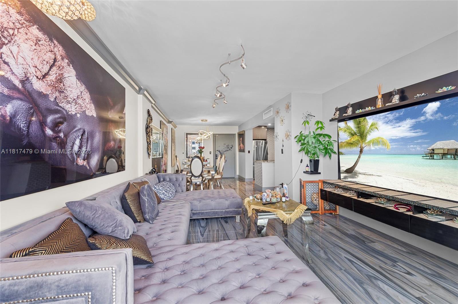 1345 Lincoln Road, Unit 1105 Miami Beach, FL 33139 - Photo 5 of 25 a living room with furniture and a flat screen tv