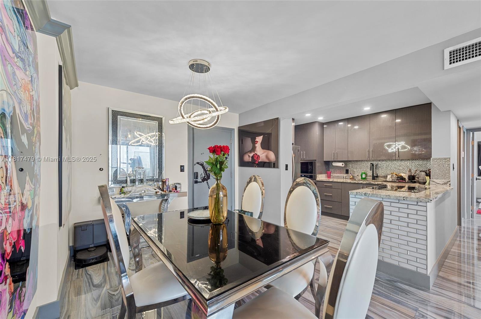 1345 Lincoln Road, Unit 1105 Miami Beach, FL 33139 - Photo 6 of 25 a view of kitchen and dining area with furniture