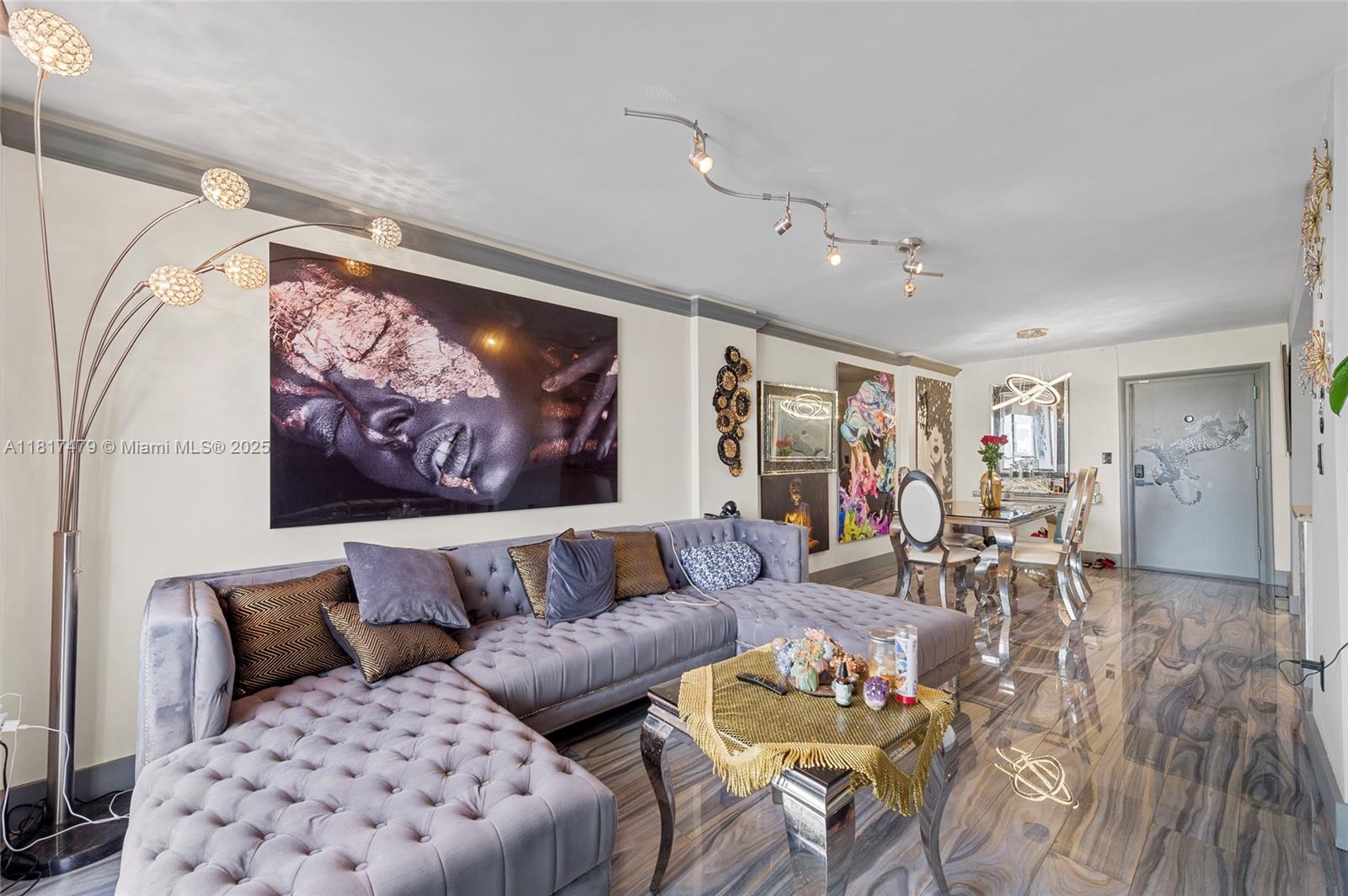 1345 Lincoln Road, Unit 1105 Miami Beach, FL 33139 - Photo 8 of 25 a living room with furniture a rug and a painting