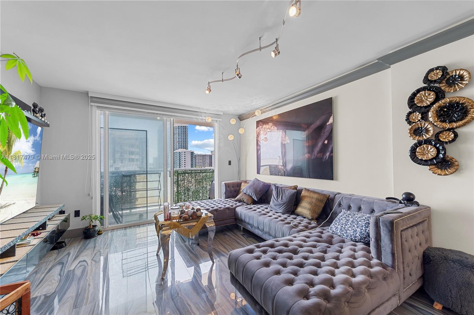 1345 Lincoln Road, Unit 1105 Miami Beach, FL 33139 - Photo 9 of 25 a bedroom with a large bed and a couch