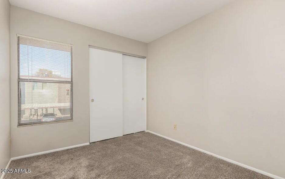 2040 South Longmore, Unit 66 Mesa, AZ 85202 - Photo 15 of 25 a view of an empty room with closet and a window