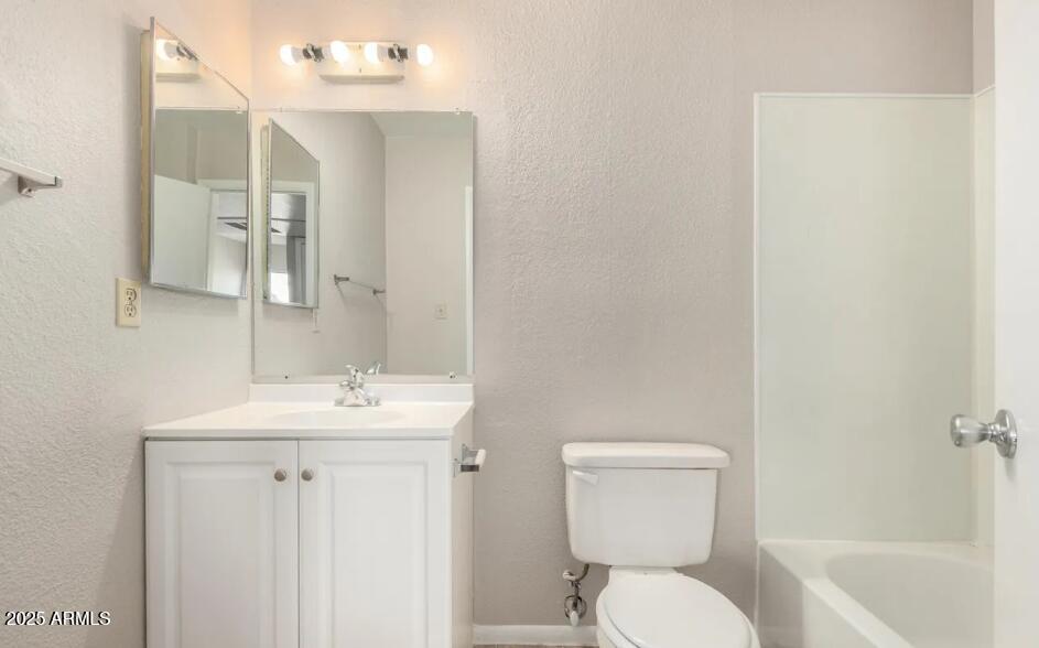 2040 South Longmore, Unit 66 Mesa, AZ 85202 - Photo 18 of 25 a bathroom with a toilet sink and mirror