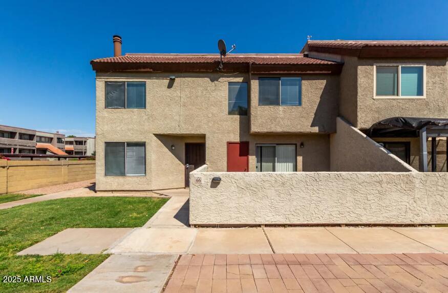 2040 South Longmore, Unit 66 Mesa, AZ 85202 - Photo 2 of 25 a front view of a house with garden