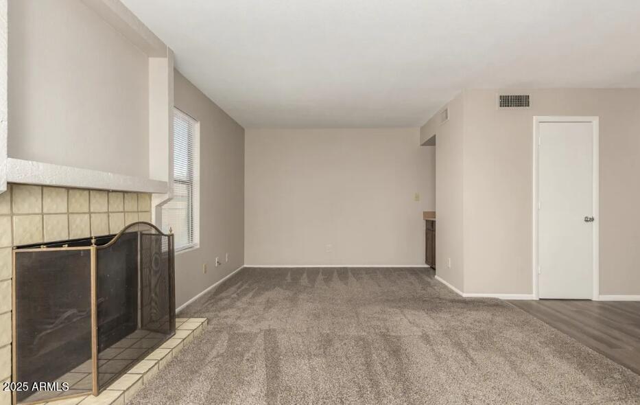 2040 South Longmore, Unit 66 Mesa, AZ 85202 - Photo 5 of 25 a view of a refrigerator in kitchen and an empty room