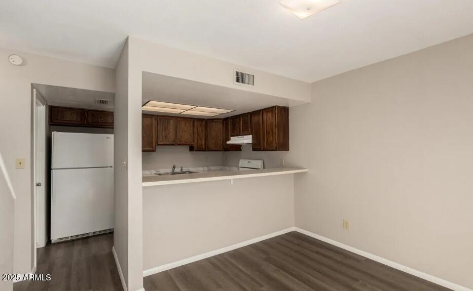 2040 South Longmore, Unit 66 Mesa, AZ 85202 - Photo 8 of 25 a kitchen with stainless steel appliances a sink and a refrigerator