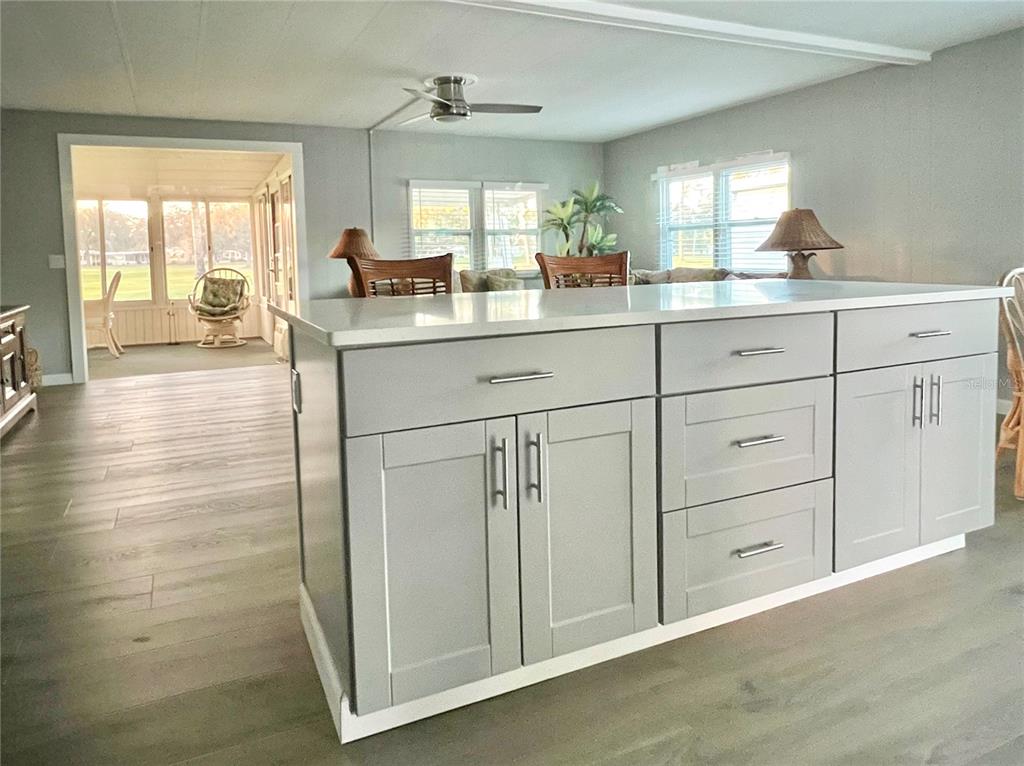 1100 South Belcher Road, Unit 469 Largo, FL 33771 - Photo 14 of 69 a kitchen with white cabinets and sink