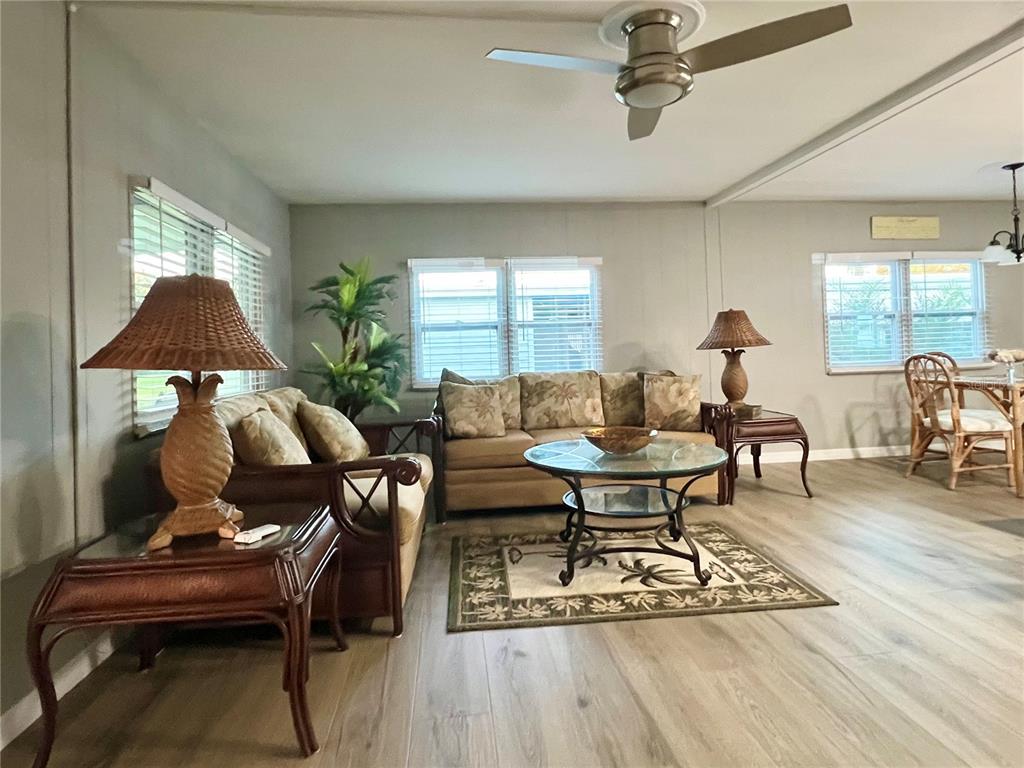 1100 South Belcher Road, Unit 469 Largo, FL 33771 - Photo 19 of 69 a living room with furniture a window and a table