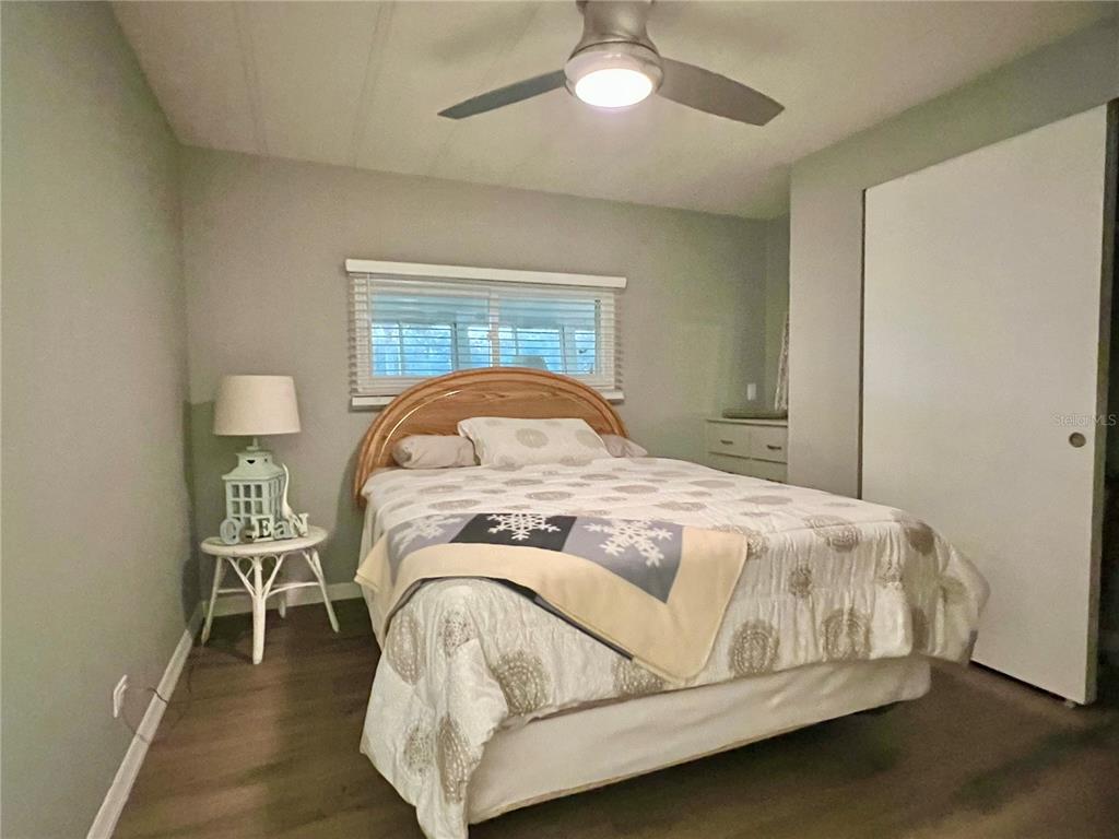 1100 South Belcher Road, Unit 469 Largo, FL 33771 - Photo 27 of 69 a bedroom with a bed and a table