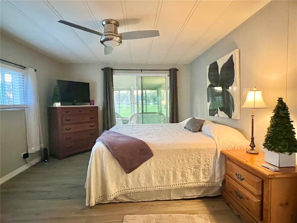 1100 South Belcher Road, Unit 469 Largo, FL 33771 - Photo 31 of 69 a bedroom with a bed and a flat screen tv