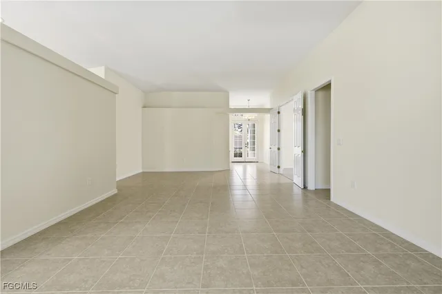 a view of a kitchen with a sink and a window