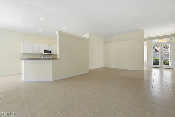 a kitchen with stainless steel appliances granite countertop white cabinets a sink and dishwasher