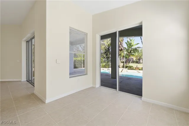 a view of an empty room with a large window