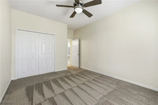 a bathroom with a bathtub shower sink vanity and toilet