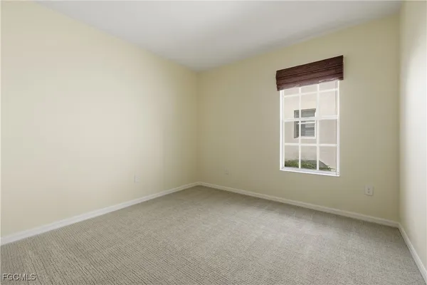 a view of an empty room and entryway