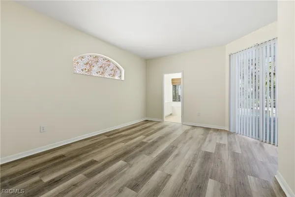 a view of an empty room and window