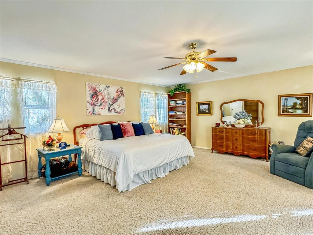 1505 Bonham Street Commerce, TX 75428 - Photo 14 of 39 Large primary bedroom with garage entry and three closets