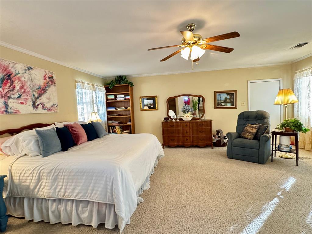 1505 Bonham Street Commerce, TX 75428 - Photo 16 of 39 Large primary bedroom with garage entry and three closets
