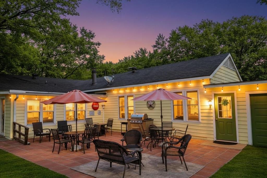 1505 Bonham Street Commerce, TX 75428 - Photo 32 of 39 outdoor cooking area. Includes a detached grill and sink that can remain with the home