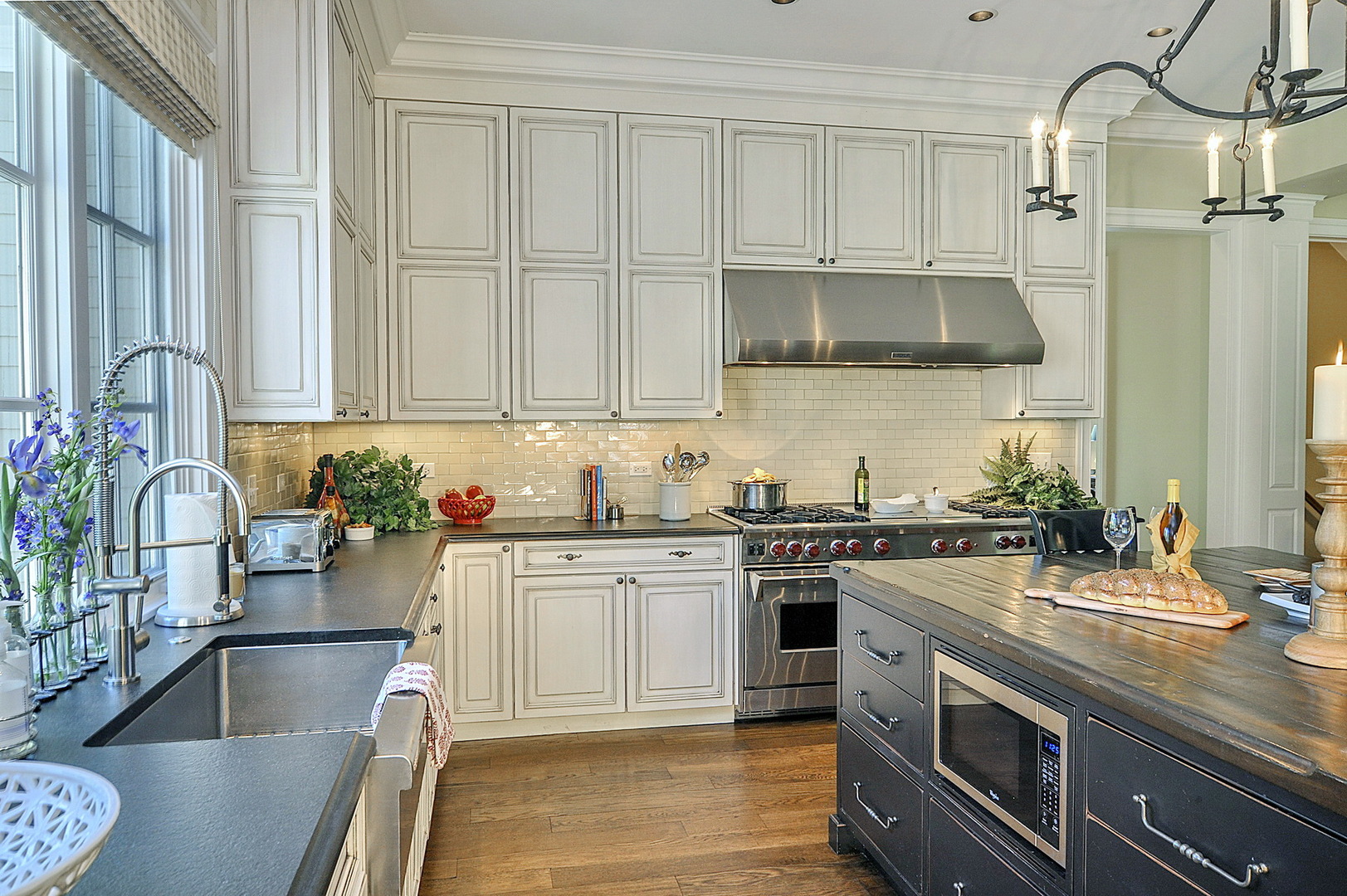 701 Plamondon Road Wheaton, IL 60189 - Photo 13 of 79 a kitchen with stainless steel appliances granite countertop a sink stove and cabinets