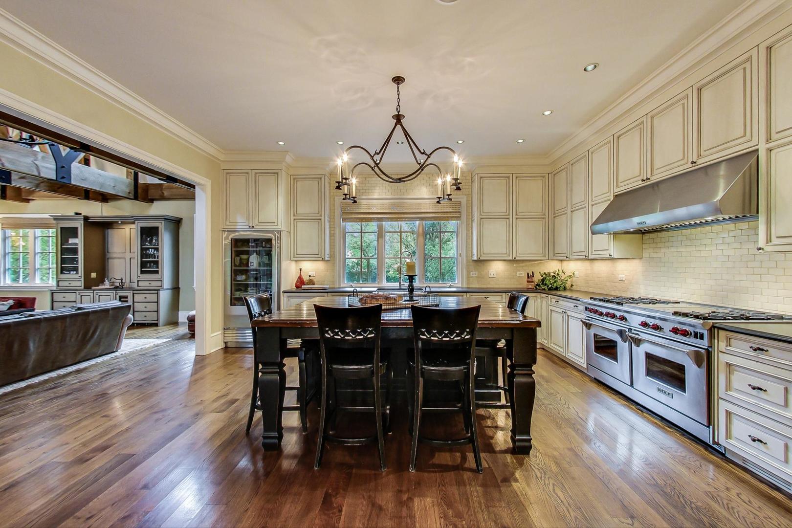 701 Plamondon Road Wheaton, IL 60189 - Photo 14 of 79 a view of a dining room with furniture window and wooden floor