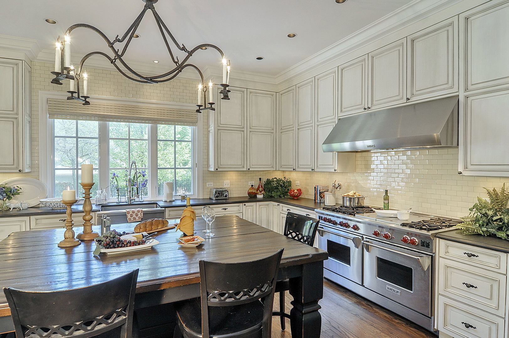 701 Plamondon Road Wheaton, IL 60189 - Photo 15 of 79 a kitchen with a stove a sink and cabinets