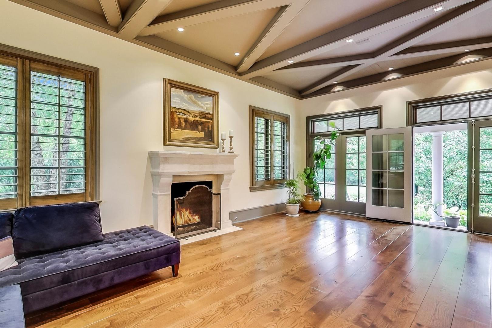 701 Plamondon Road Wheaton, IL 60189 - Photo 20 of 79 a living room with furniture large windows and wooden floor