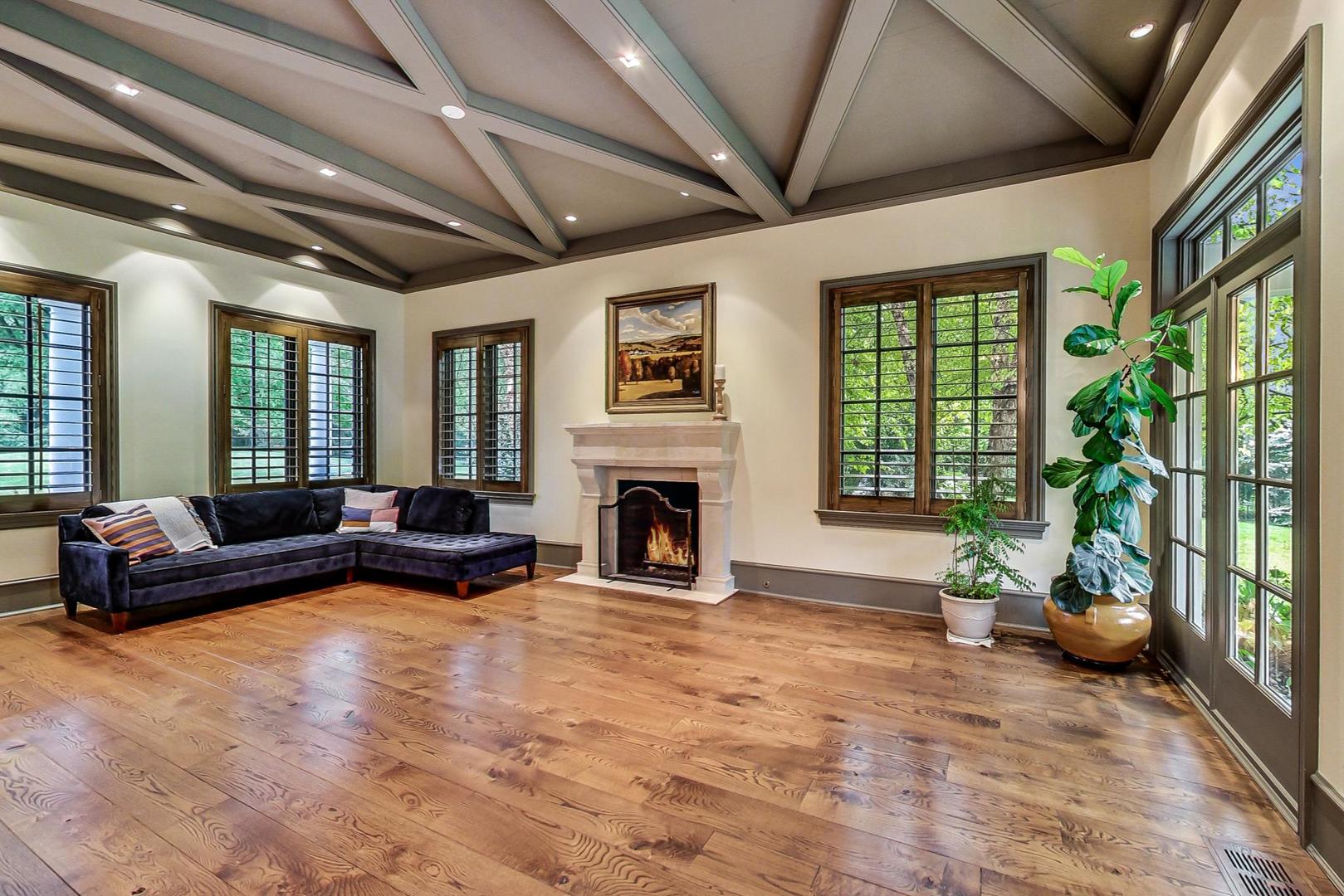 701 Plamondon Road Wheaton, IL 60189 - Photo 21 of 79 a living room with furniture large window and a fireplace